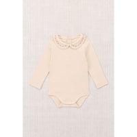 Misha and Puff String Baby Millefleurs Petit Collar Onesie