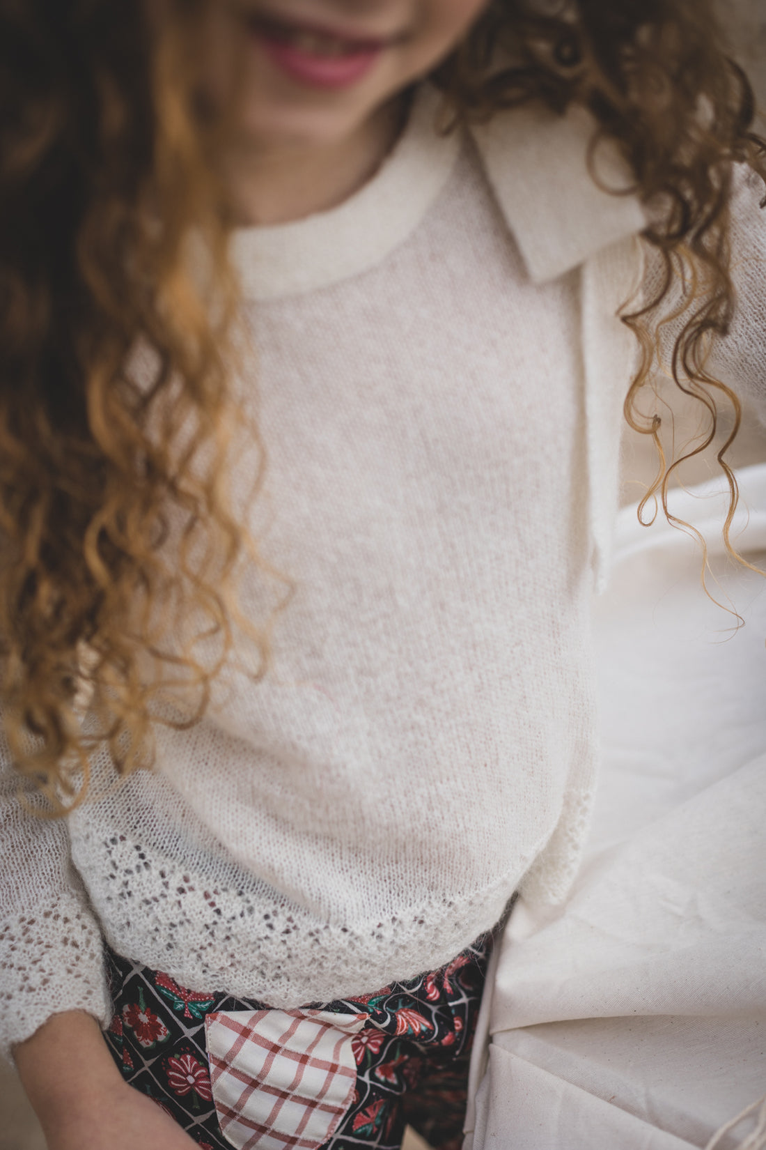 Birinit Ivory Bow Jersey Pullover