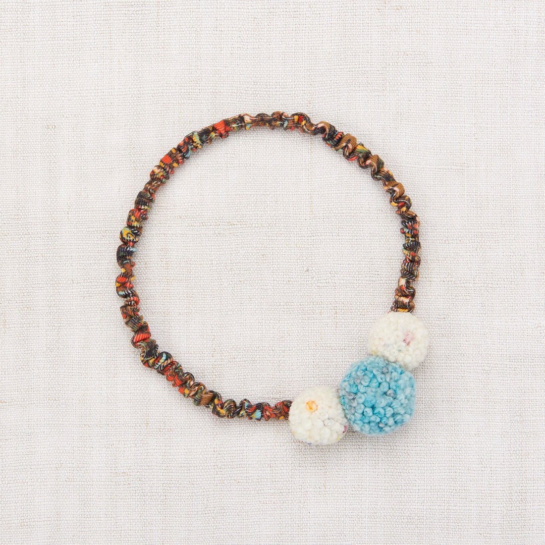 Misha and Puff Pom Pom Headband - Antique Brass Folk Tile