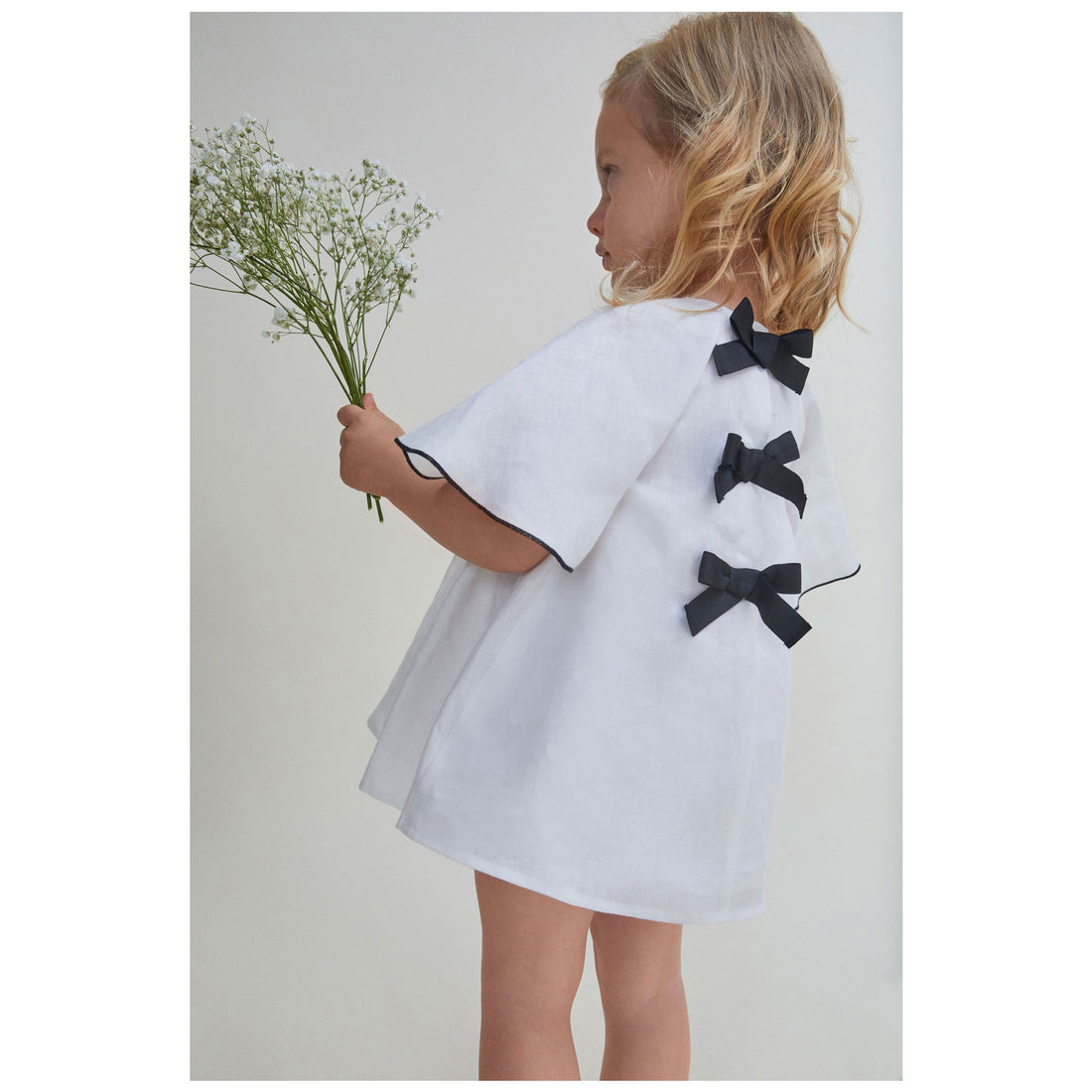 Nueces Ivory Linen Orchid Bow Dress