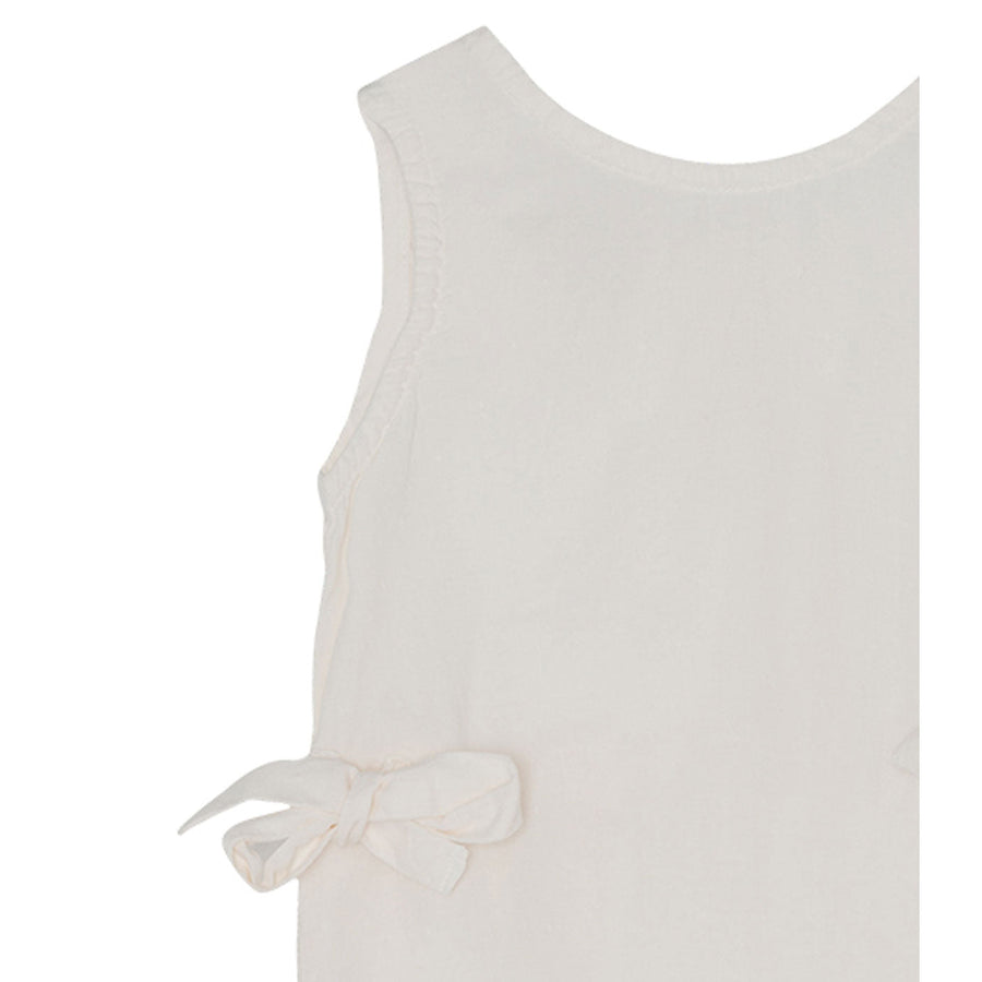 Yellow Pelota Rompers and Bodysuits Yellow Pelota Natural Flour Bow Romper